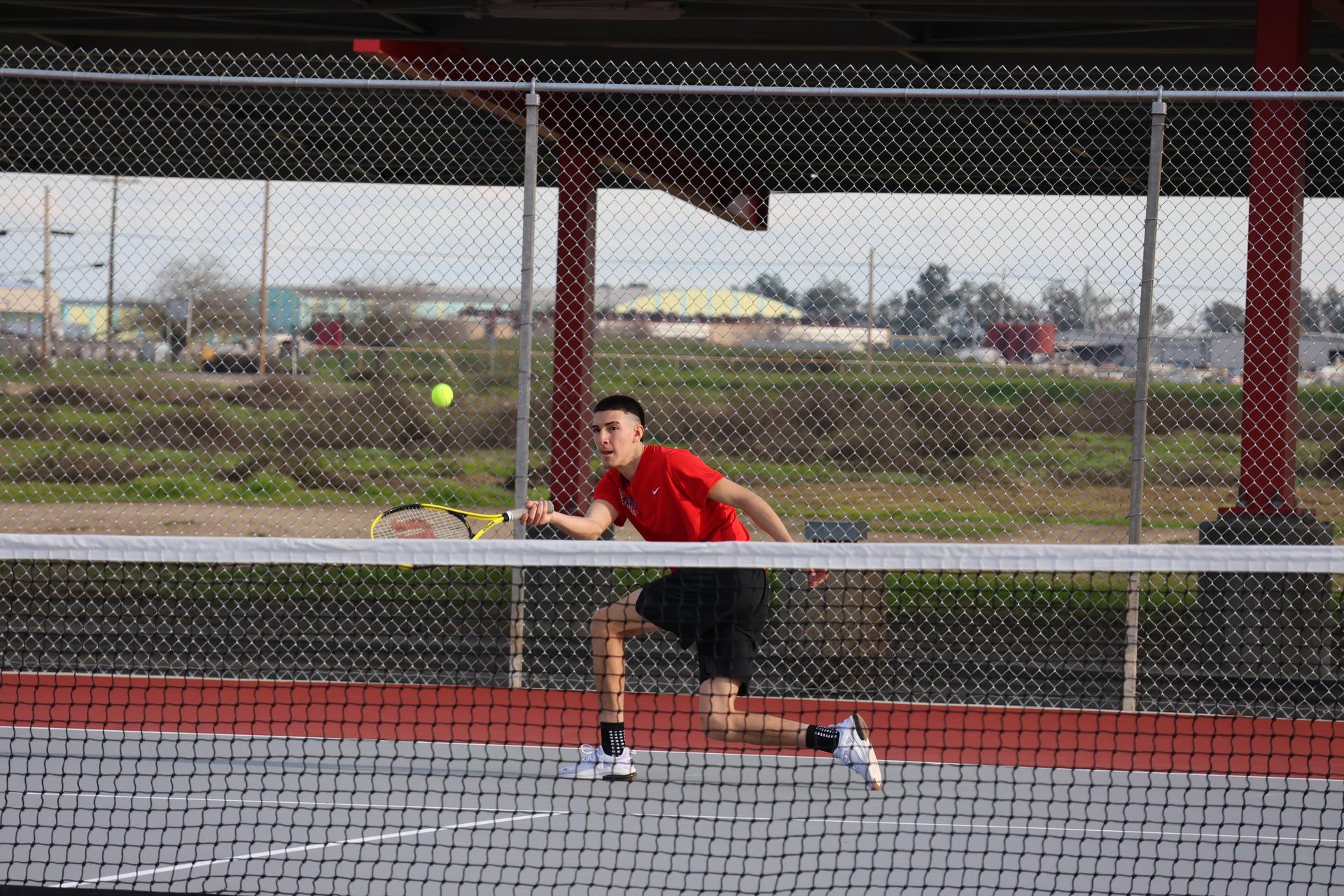 CUHS Boys playing tennis against coalinga