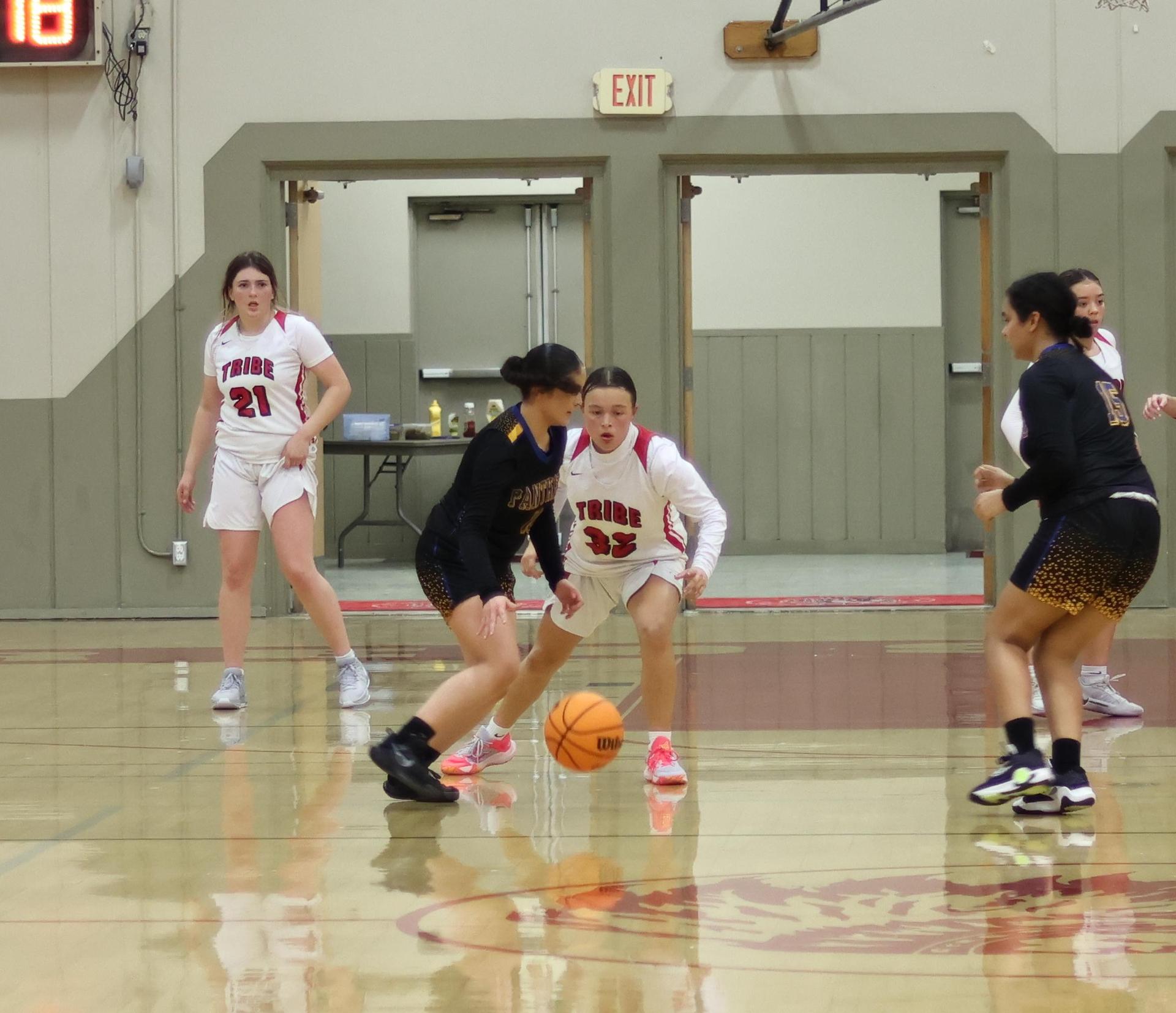 junior varsity girls playing basketball against parlier