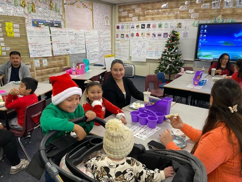 students with parents at event
