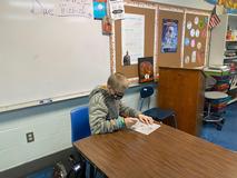 Students working on Christmas door decorations