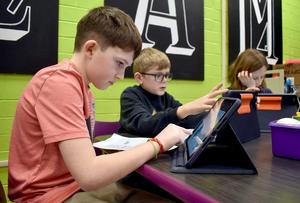 Students using an iPad