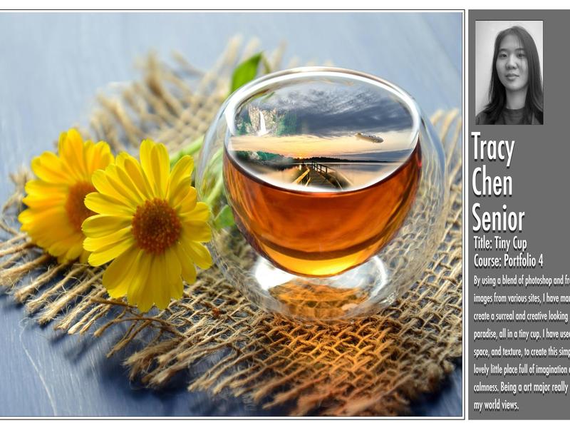 Tea cup with a landscape inside, set with flowers on a textured mat.