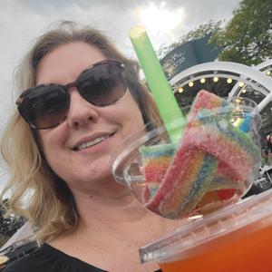 Teacher showing more food at event.