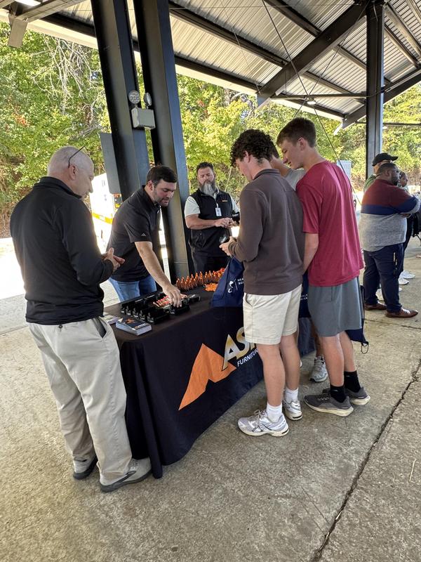 PHS students at the career fair, meeting with different people at tables