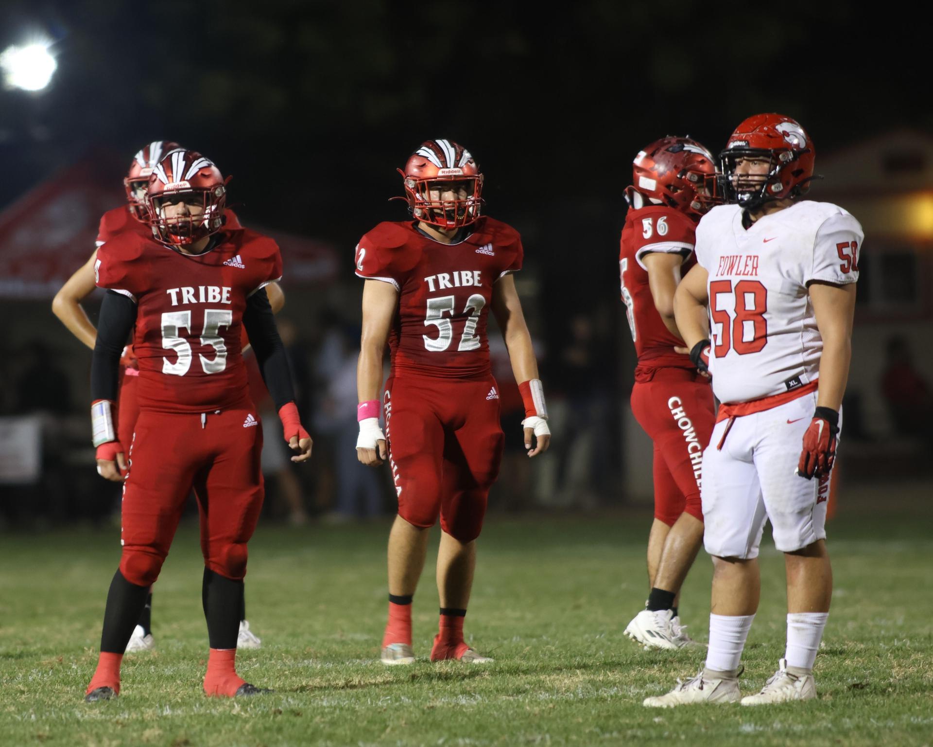 varsity boys playing football against Fowler