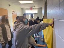 Students working on Christmas door decorations
