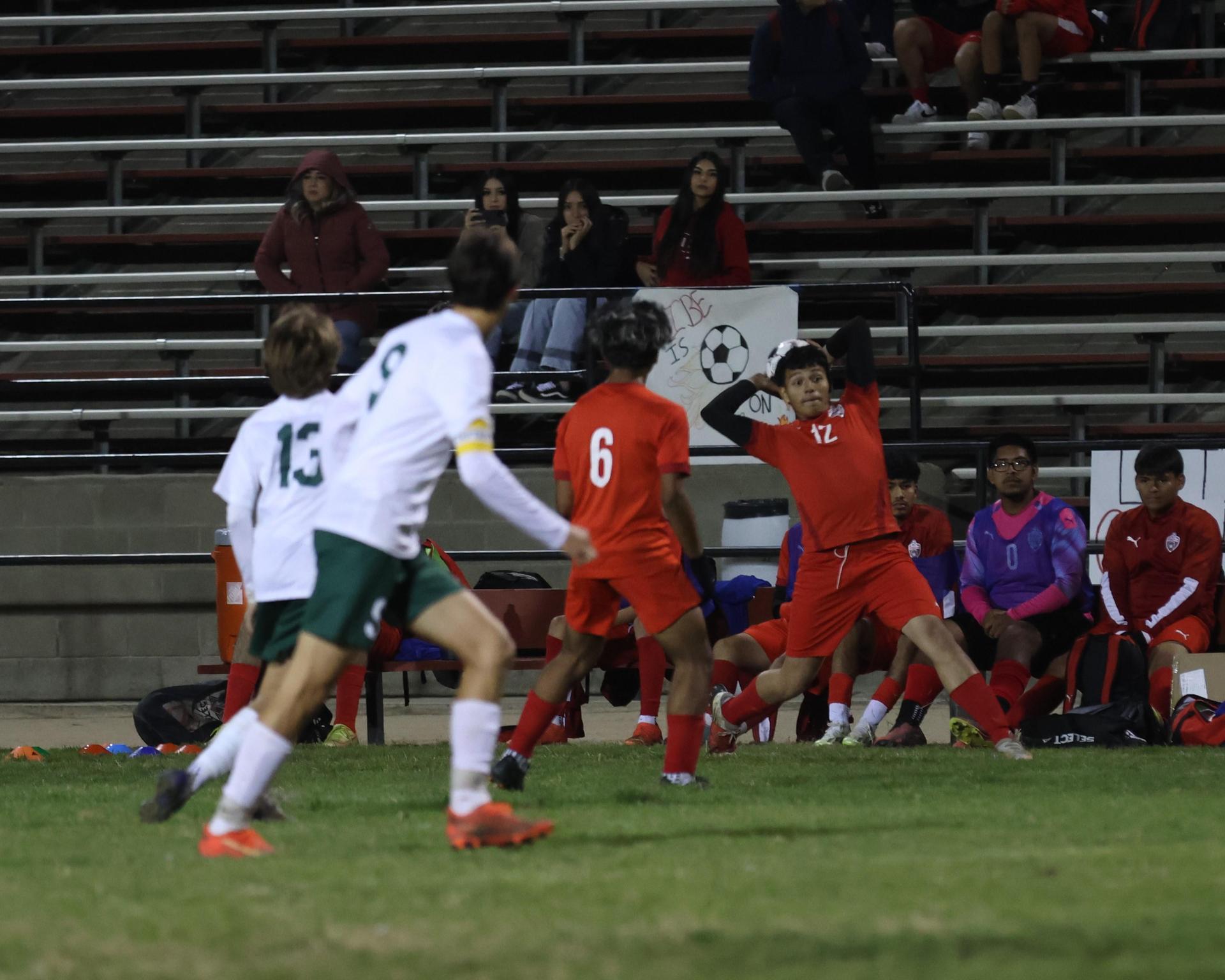 Varsity boys play soccer against Kingsburg