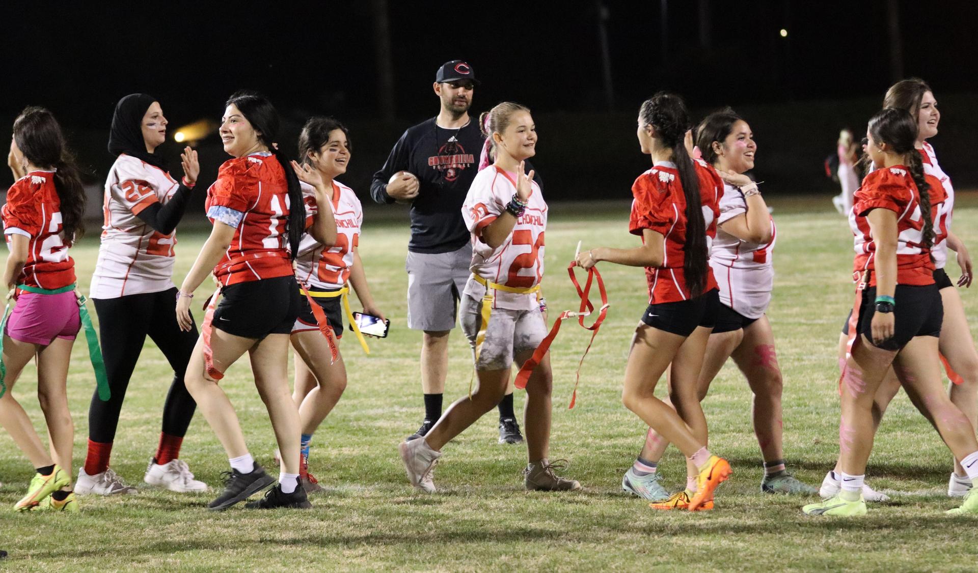 students shaking hands after the game