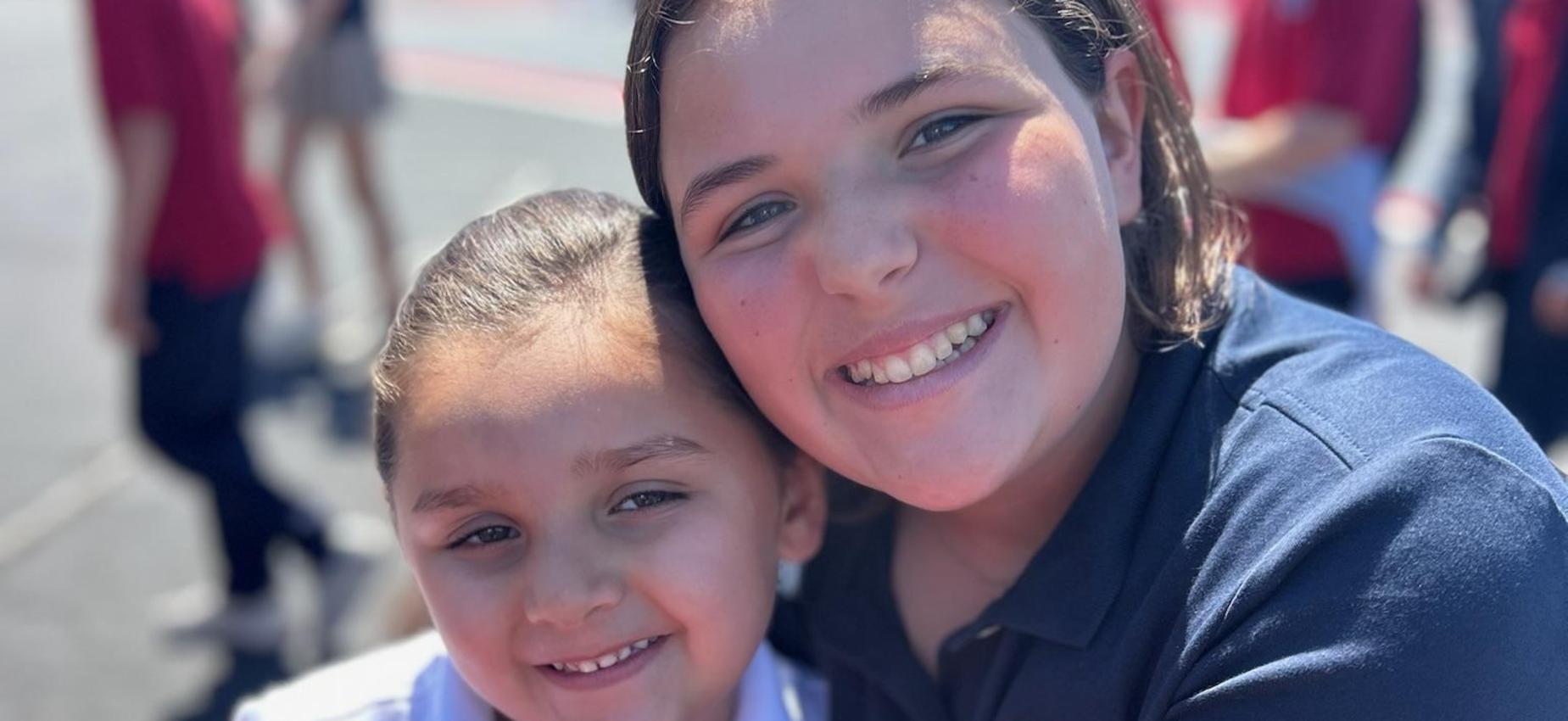 friendship buddies pose outside