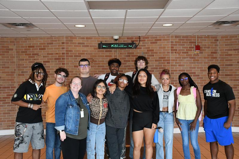 PAL and Pathway students with Ashley O Niel standing and smiling for the camera