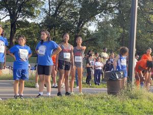 a group photo of the track team at the meet