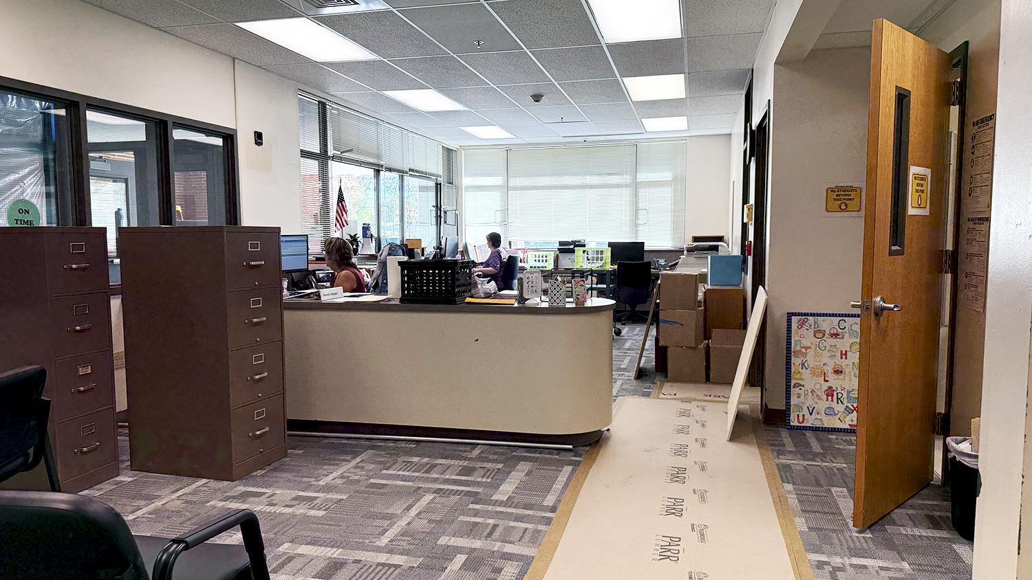 staff in newly-carpeted main office