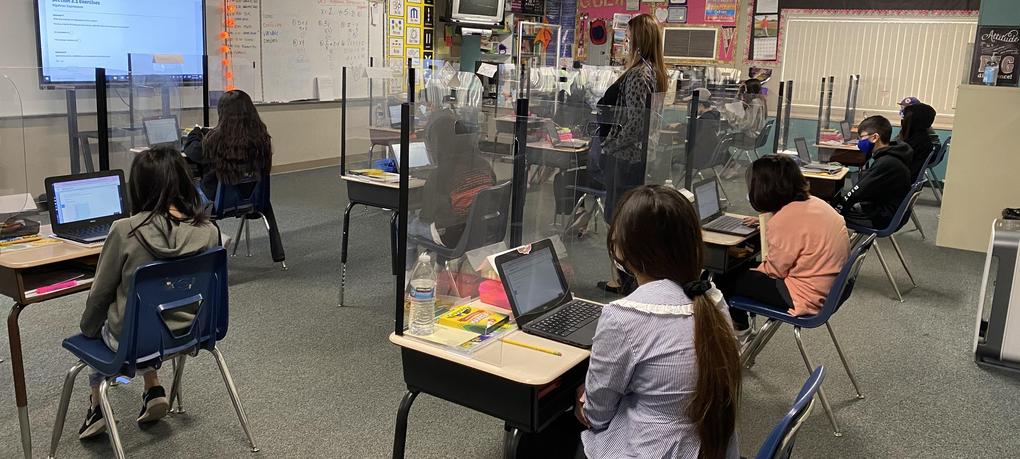Students sit at their desks.