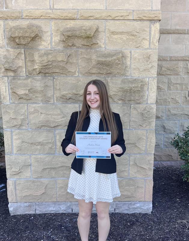 Aubrie Moon poses with award