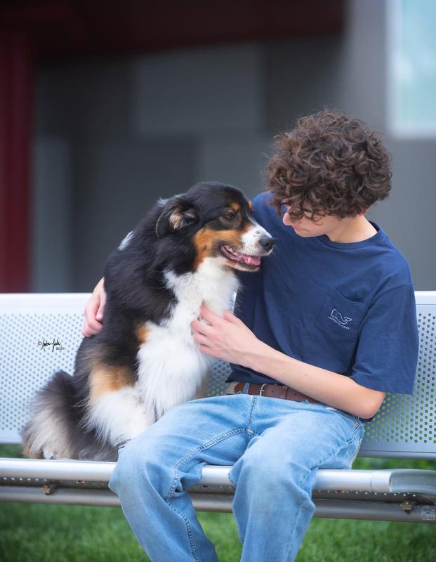 Sawyer Johnson smiling with dog