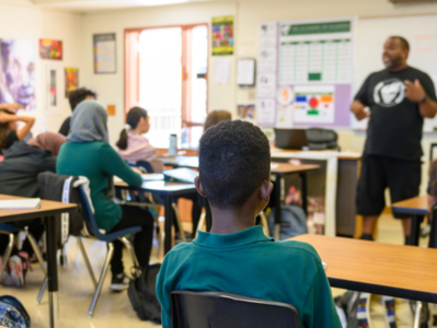 Teacher speaking to students