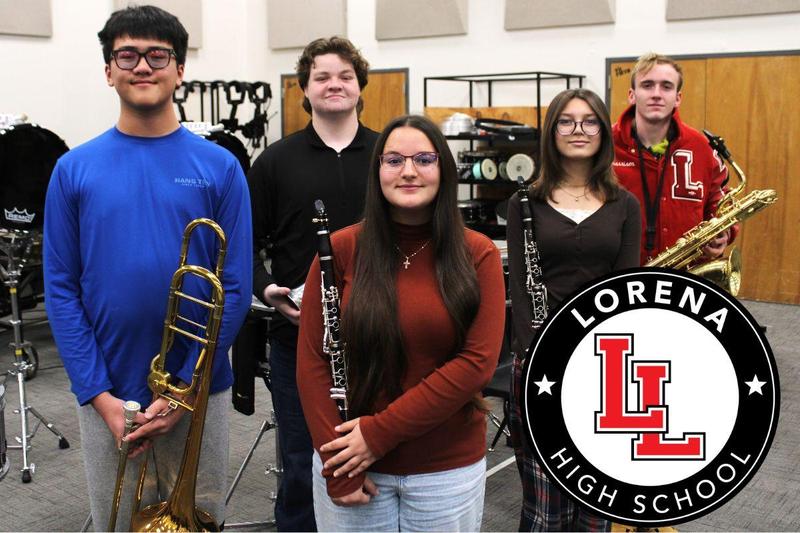 Lorena High School band stduents standing in a group holding instruments in the band hall