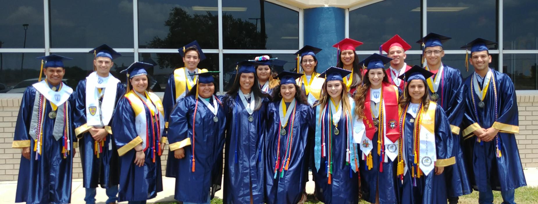 Former Truman Students stand in front of their former elementary school.
