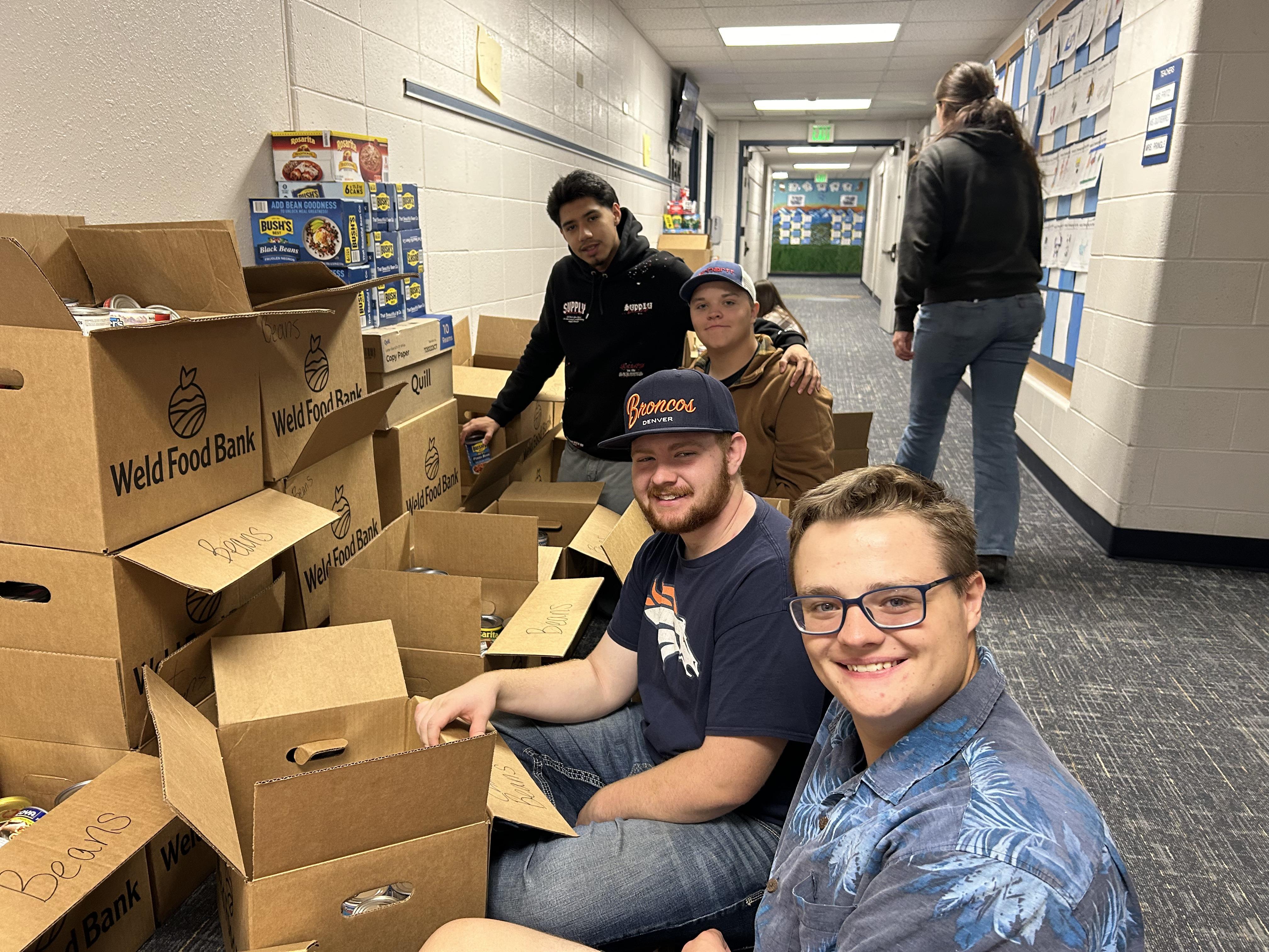NHS Students Organizing Cans for Food Drive