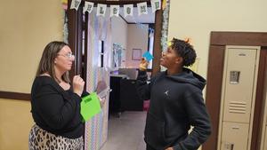 Student with Ms.Abrams answering a question.