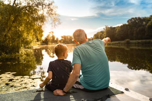 grandpa and grandson on a dock