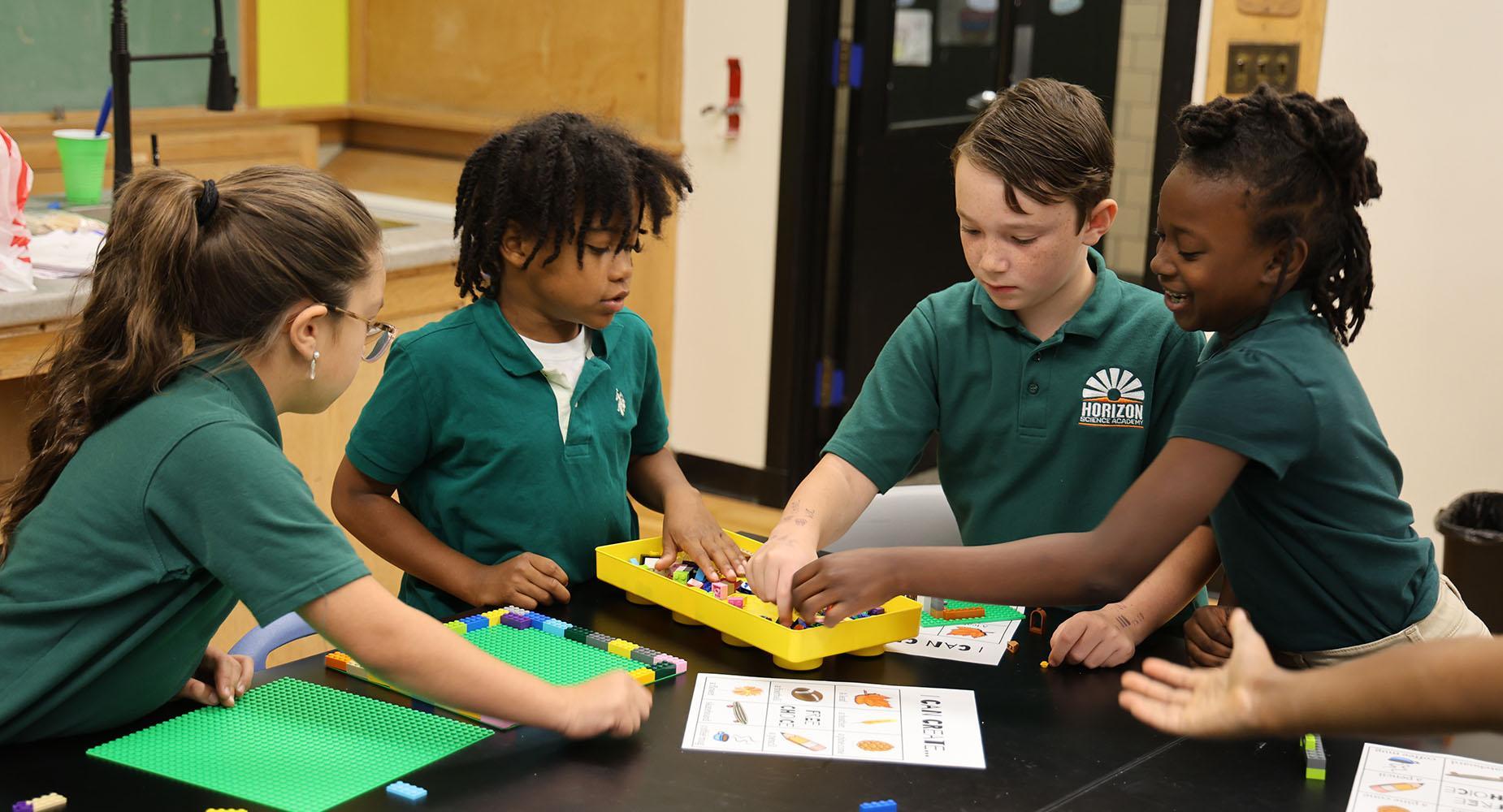Group of HSA Des Moines students working together in the classroom
