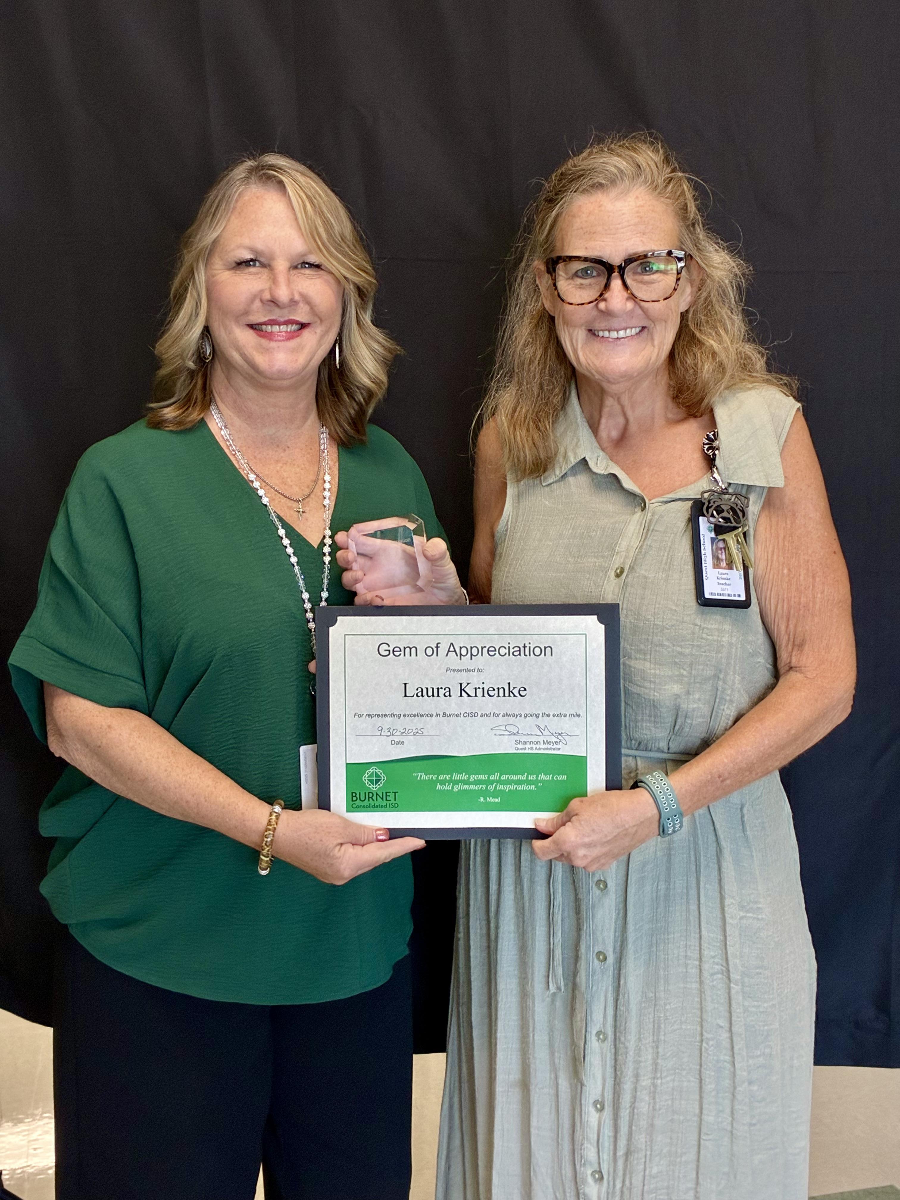 image of Mrs. Meyer giving Mrs. Krienke the GEM award and certificate