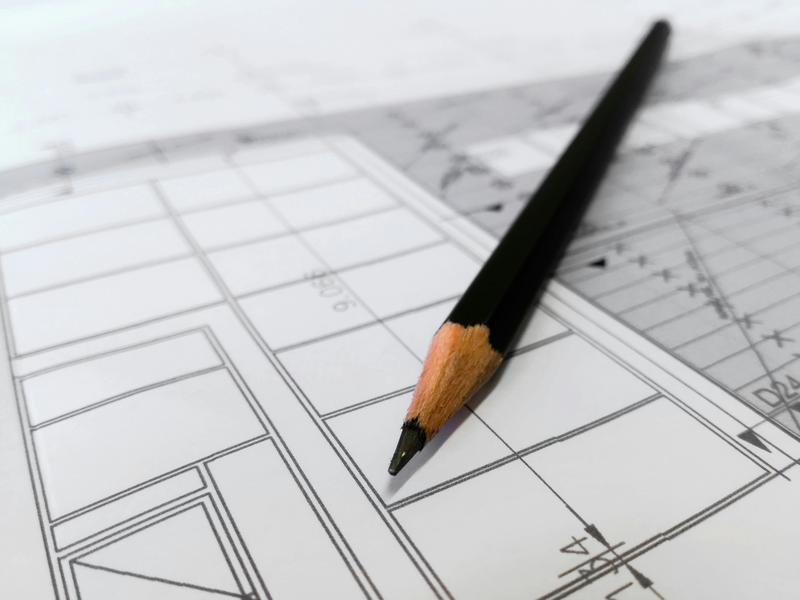 A pencil sitting on an architectural drawing