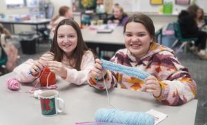 Students work on their crochet projects in their Middle School crochet club.