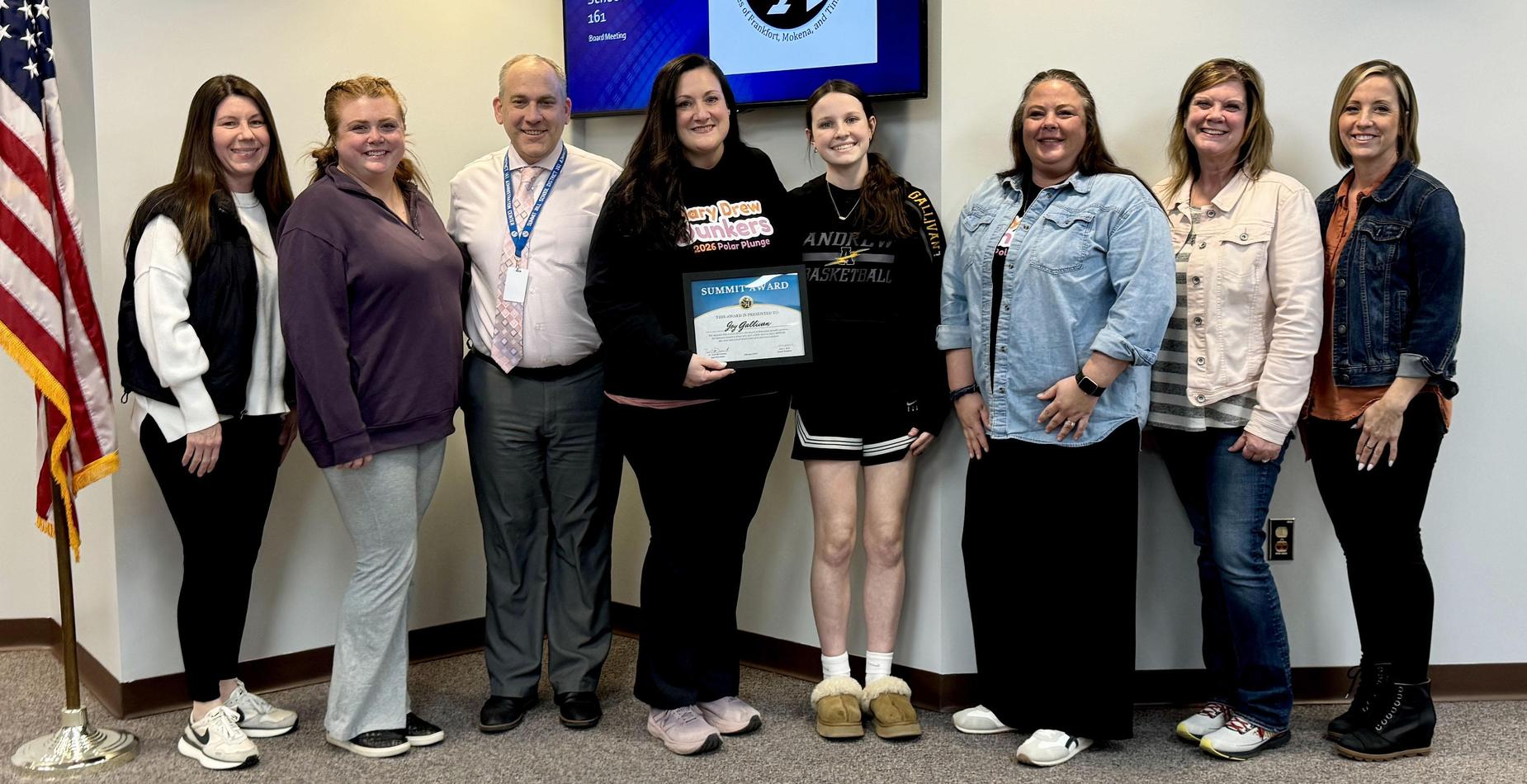 Mary Drew Early Learning Center Social Worker Joy Gallivan receives her Summit Award during the February meeting of the SHSD161 Board of Education
