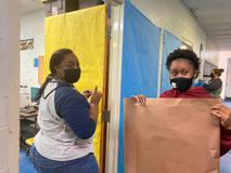 Students working on Christmas door decorations