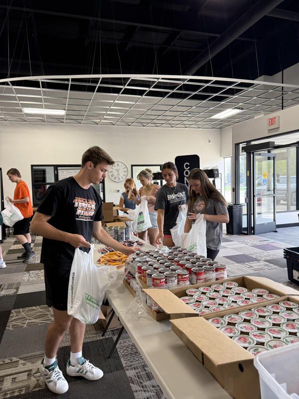 Students help at the Journey Church food pantry.