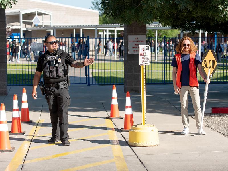 school resource officer directing traffic