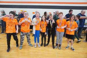 TK students pose with their medals from the regional OM contest.