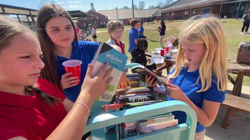 Southeast Middle School Tailgate Party Students at the Book Cart