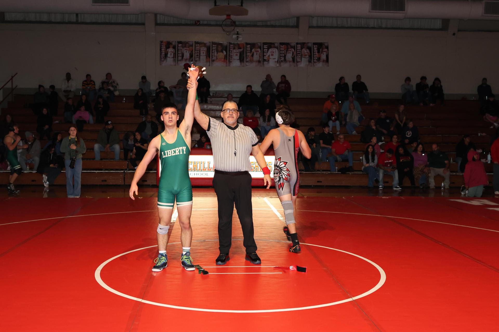 Wrestling winners with hands up 123