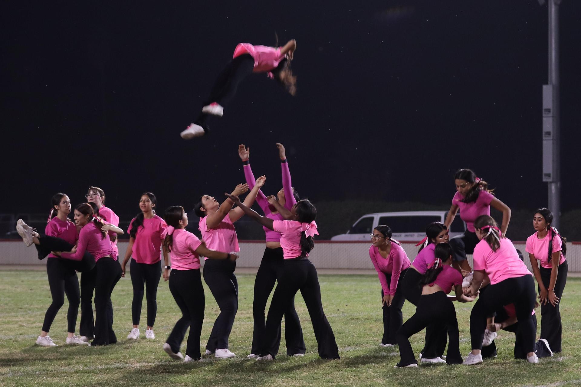 Varsity Cheer performing at halftime vs. Fowler