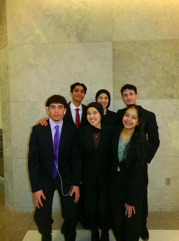 Image of 6 students dressed in suits