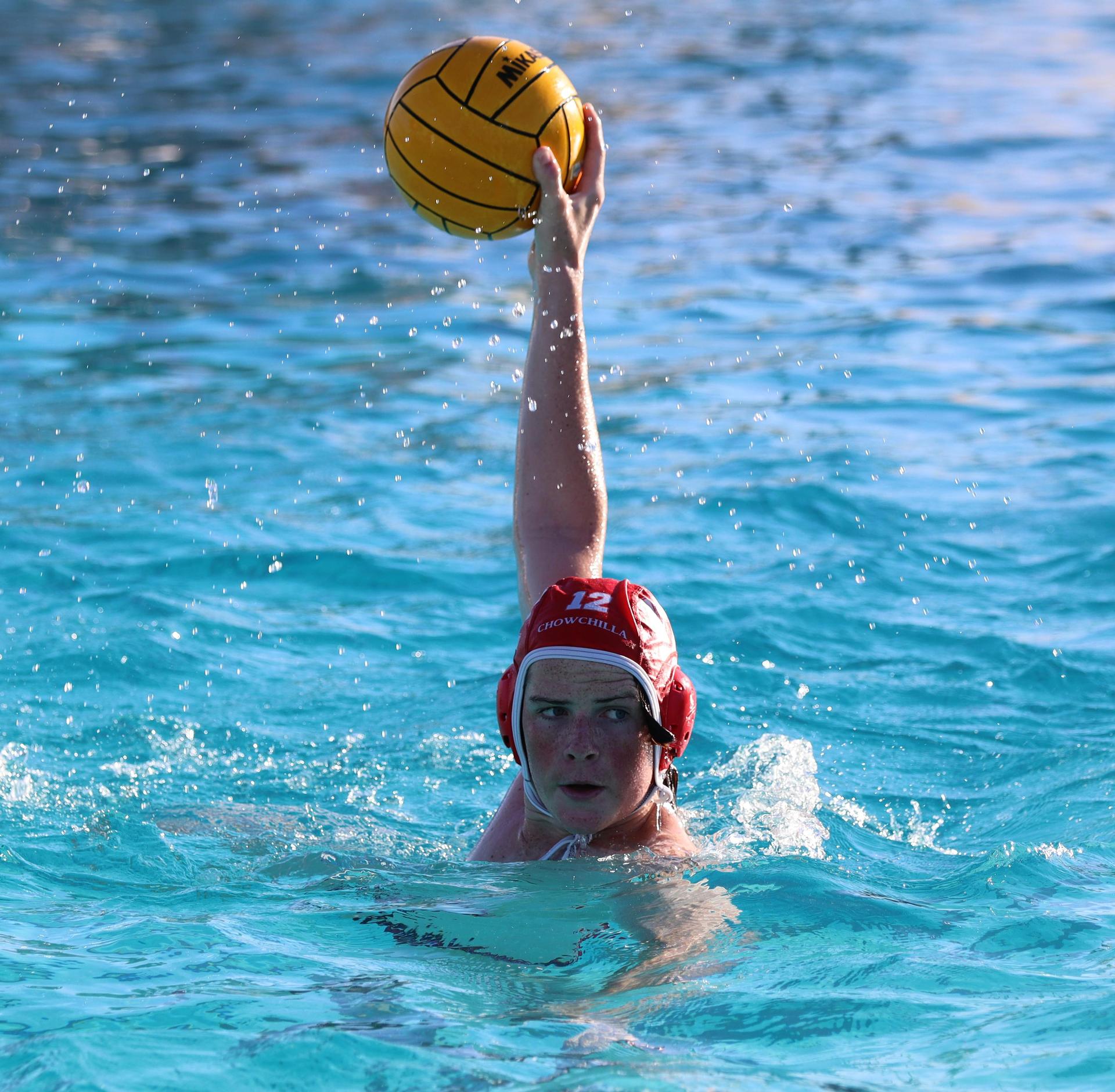 boys water polo players in action against san joaquin memorial