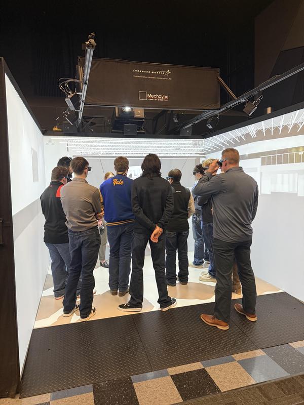 A group checking out a simulation room.