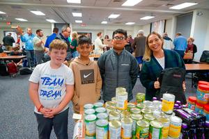 Willow Bend Students pose with a community volunteer