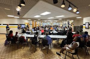 Wide view of PHS seniors listening to ICC recruiters in the Commons