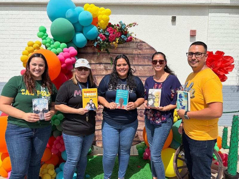 educator hold up books for CCL