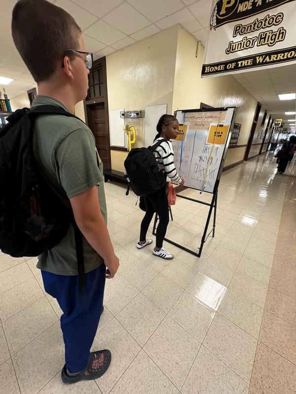 students wait to place their mark