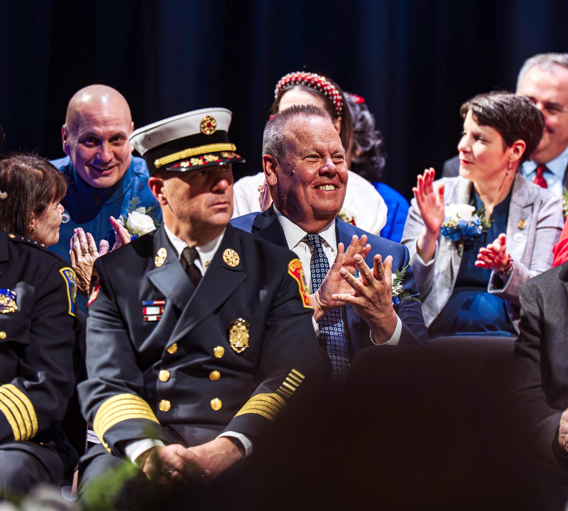 People seated on a stage