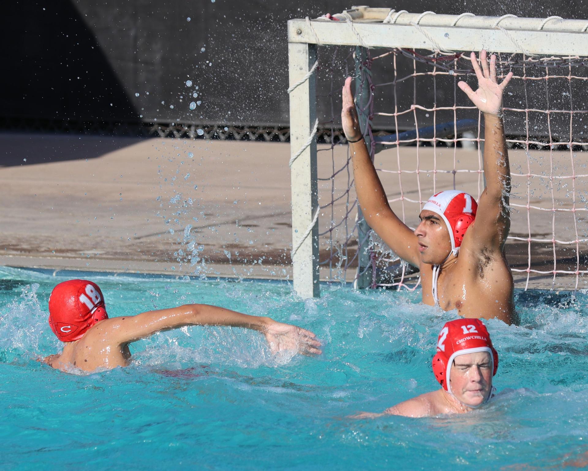 Boys playing water polo against Yosemite