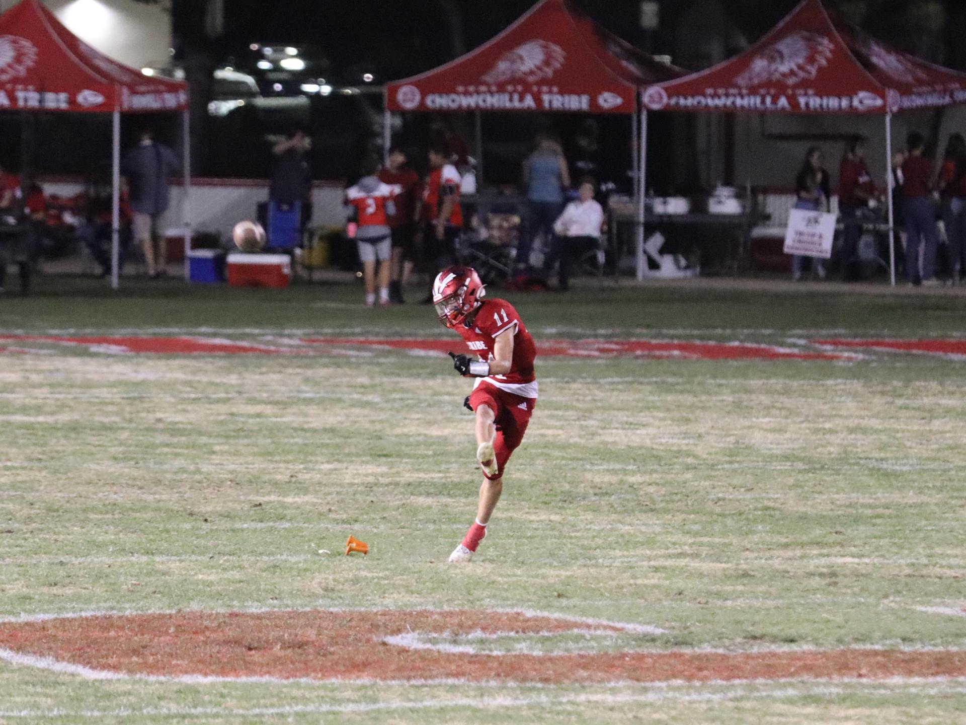 varsity football players in action against Riverdale