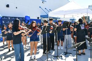 The Challenger Band plays an entrance and exit performance as guests enter the new music building.