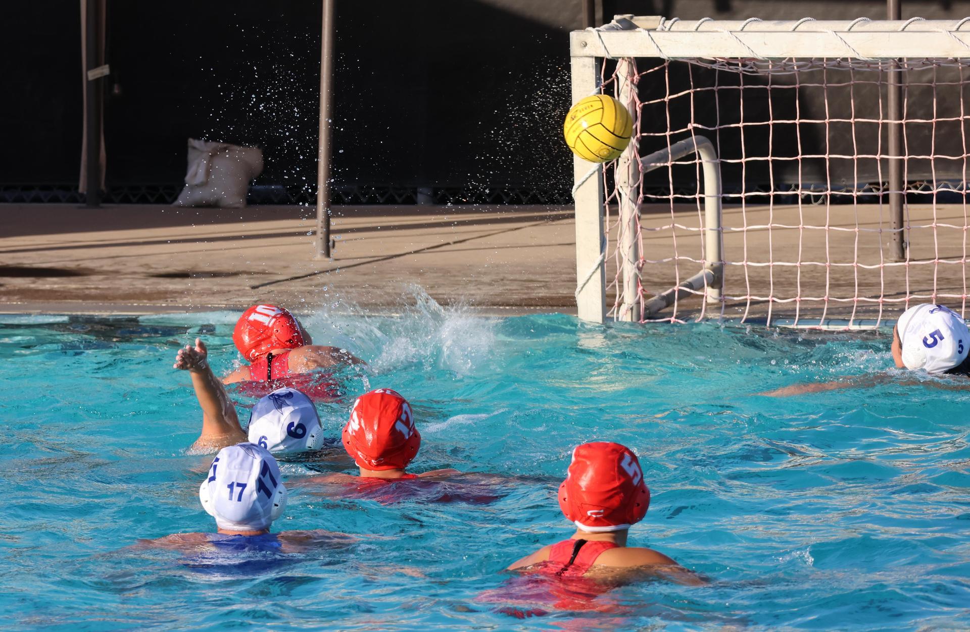 girls playing water polo against Sanger West