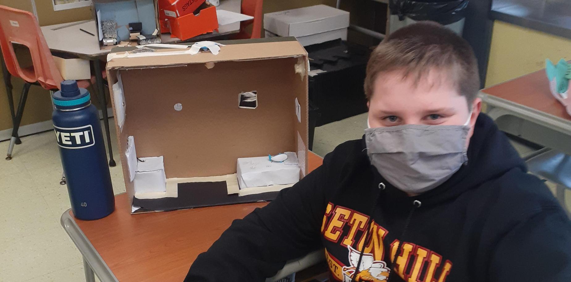 student with his electrical circuit project